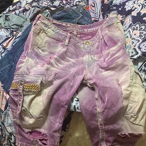 I am selling a pair of robins jeans shorts.They are purple with distressed white